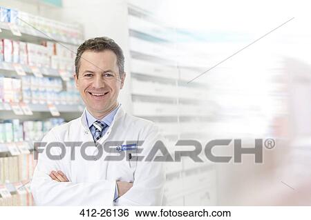 Portrait of smiling pharmacist with arms crossed in pharmacy View Large Photo Image Stock Photograph - Portrait of smiling pharmacist with arms crossed in pharmacy. Fotosearch