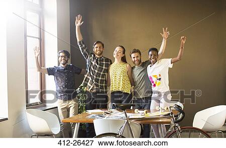 Portrait waving creative business people in office View Large Photo Image Stock Photo - Portrait waving creative business people in office. Fotosearch