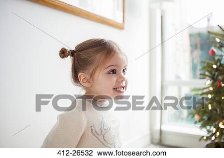 Smiling girl looking away View Large Photo Image Stock Image - Smiling girl looking away. Fotosearch