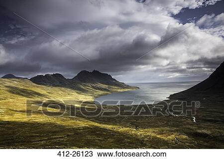 "Sun shining along cliffs and shore, Veidileysa, West Fjords, Iceland" View Large Photo Image Stock Image - "Sun shining along cliffs and shore, Veidileysa, West Fjords, Iceland". Fotosearch