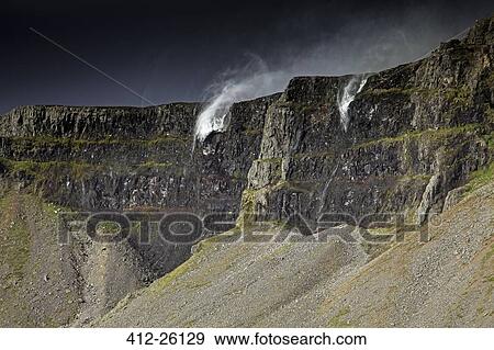 Stock Photo - "Water splashing over cliffs, Raudasandur, Iceland". Fotosearch