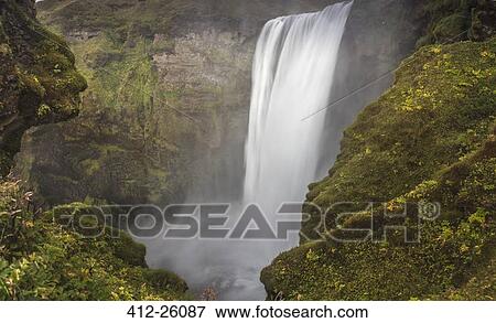 "Waterfall surrounded by mossy rocks, Trolls View, Skogarfoss, Iceland" View Large Photo Image Stock Photo - "Waterfall surrounded by mossy rocks, Trolls View, Skogarfoss, Iceland". Fotosearch