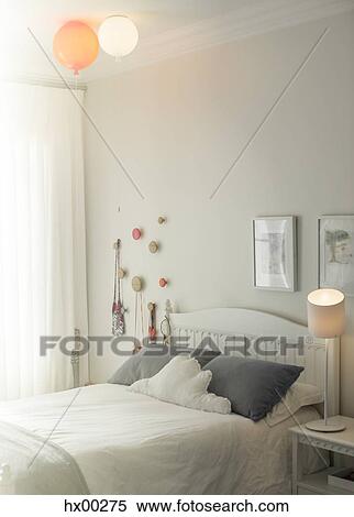 Balloon lights over child’s bed View Large Photo Image Stock Photography - Balloon lights over child’s bed. Fotosearch