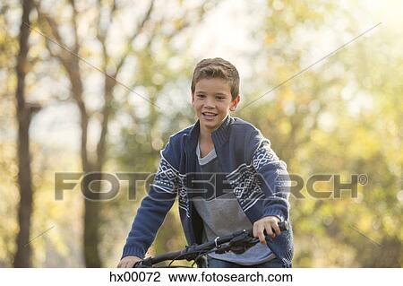 Boy bike riding View Large Photo Image Stock Image - Boy bike riding. Fotosearch