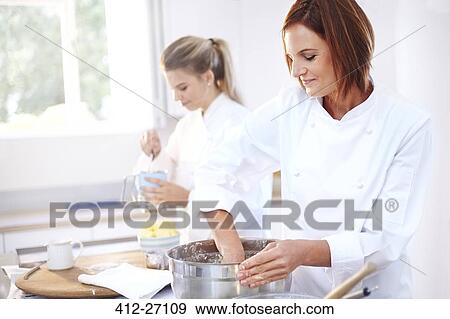 Stock Photo - Chefs baking in kitchen. Fotosearch