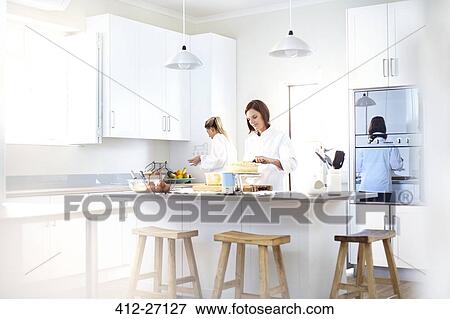 Stock Photo - Chefs baking in kitchen. Fotosearch