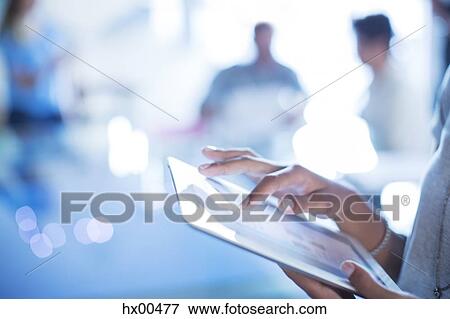 Stock Photo - Close up businesswoman using digital tablet. Fotosearch