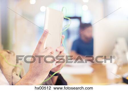 Close up creative businessman using digital tablet View Large Photo Image Stock Image - Close up creative businessman using digital tablet. Fotosearch