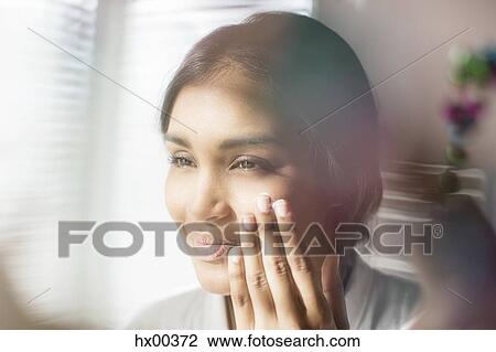 Close up woman applying moisturizer to face View Large Photo Image Stock Image - Close up woman applying moisturizer to face. Fotosearch