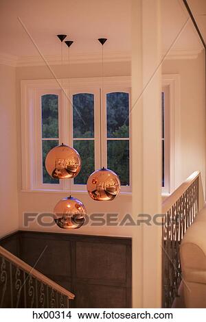 Copper pendant lights hanging over stairway View Large Photo Image Picture - Copper pendant lights hanging over stairway. Fotosearch