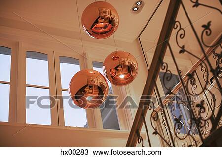 Copper pendant lights hanging over staircase View Large Photo Image Stock Image - Copper pendant lights hanging over staircase. Fotosearch