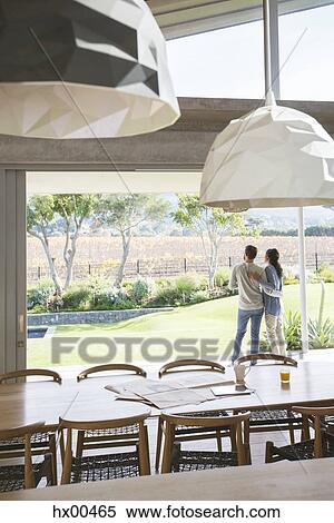 Couple hugging on luxury patio View Large Photo Image Stock Photography - Couple hugging on luxury patio. Fotosearch