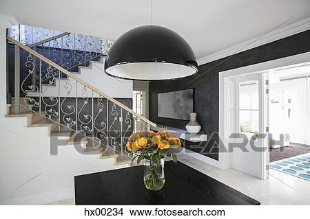 Picture - Domed light over rose bouquet in luxury dining room. Fotosearch