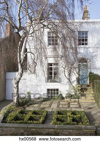 Elegant house with boxwoods View Large Photo Image Stock Photo - Elegant house with boxwoods. Fotosearch