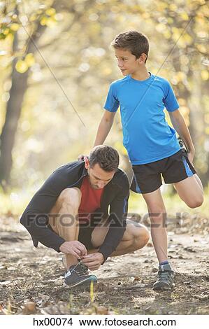 Father and son stretching and preparing to run View Large Photo Image Picture - Father and son stretching and preparing to run. Fotosearch