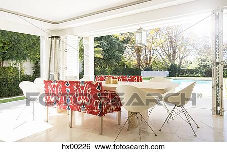 Home showcase dining room open to patio View Large Photo Image Stock Photograph - Home showcase dining room open to patio. Fotosearch