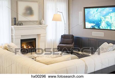 Stock Photograph - Home showcase living room with TV and fireplace. Fotosearch