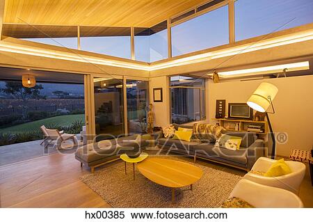 Illuminated modern living room View Large Photo Image Stock Photography - Illuminated modern living room. Fotosearch