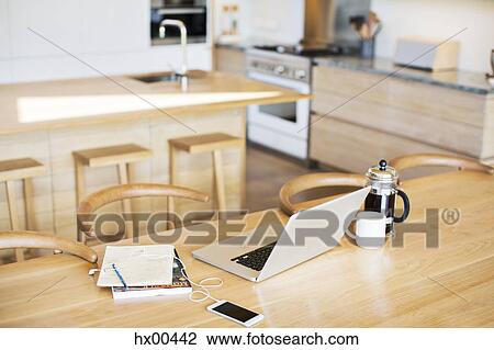 Laptop, French press coffee, cell phone and notebook on kitchen table View Large Photo Image Stock Image - Laptop, French press coffee, cell phone and notebook on kitchen table. Fotosearch