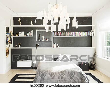 Modern paper chandelier hanging over bed in bedroom View Large Photo Image Stock Image - Modern paper chandelier hanging over bed in bedroom. Fotosearch