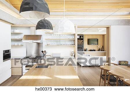 Modern pendant lights over wood kitchen island View Large Photo Image Stock Image - Modern pendant lights over wood kitchen island. Fotosearch