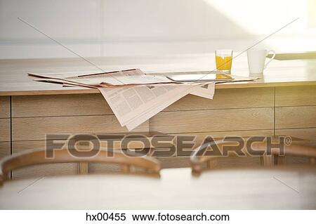 Newspaper, orange juice and coffee on kitchen island View Large Photo Image Stock Photography - Newspaper, orange juice and coffee on kitchen island. Fotosearch