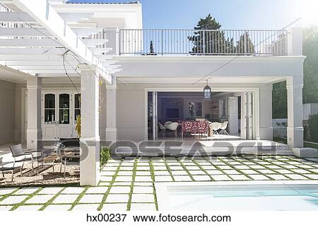 Paving stones at poolside patio of luxury house View Large Photo Image Stock Photo - Paving stones at poolside patio of luxury house. Fotosearch