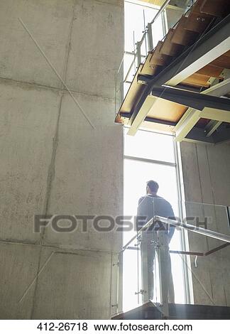 Pensive man at window on platform View Large Photo Image Stock Photo - Pensive man at window on platform. Fotosearch