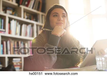Pensive teenage girl with digital tablet View Large Photo Image Stock Image - Pensive teenage girl with digital tablet. Fotosearch