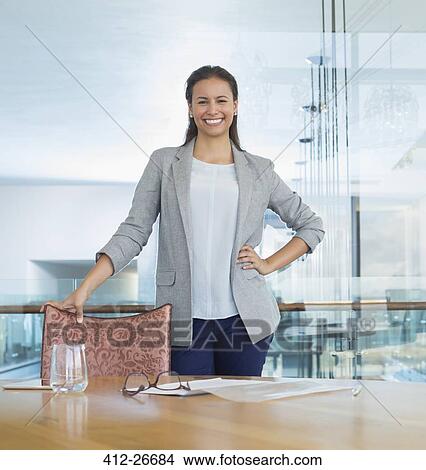 Portrait confident businesswoman in conference room View Large Photo Image Picture - Portrait confident businesswoman in conference room. Fotosearch