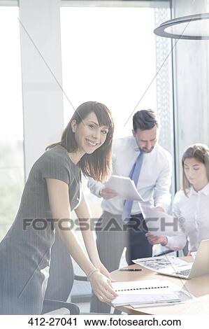 Portrait confident businesswoman in conference room meeting View Large Photo Image Stock Image - Portrait confident businesswoman in conference room meeting. Fotosearch