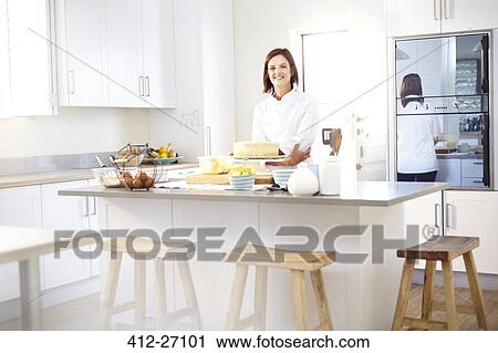 Stock Image - Portrait confident chef in kitchen. Fotosearch