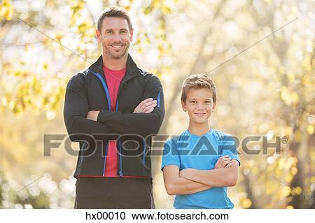 Portrait confident father and son with arms crossed outdoors View Large Photo Image Stock Image - Portrait confident father and son with arms crossed outdoors. Fotosearch