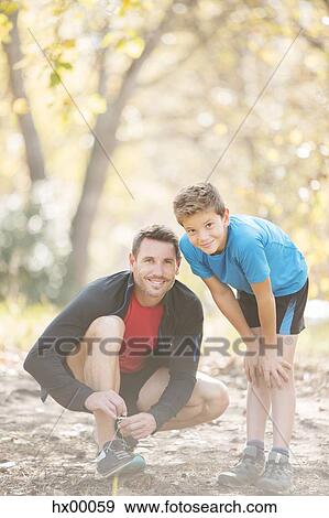 Portrait father and son preparing for hike in woods View Large Photo Image Stock Photo - Portrait father and son preparing for hike in woods. Fotosearch