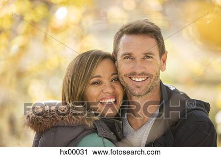 Portrait smiling couple outdoors View Large Photo Image Stock Image - Portrait smiling couple outdoors. Fotosearch