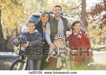Portrait smiling family with bicycles outdoors View Large Photo Image Stock Photography - Portrait smiling family with bicycles outdoors. Fotosearch