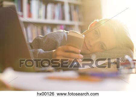 Stock Photograph - Portrait smiling teenage girl texting with cell phone. Fotosearch