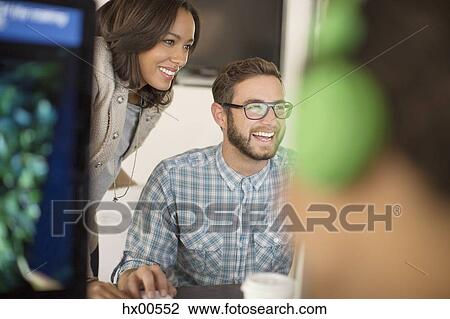 Smiling business people in office View Large Photo Image Stock Image - Smiling business people in office. Fotosearch