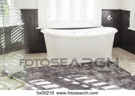 Soaking tub in luxury bathroom View Large Photo Image Stock Photo - Soaking tub in luxury bathroom. Fotosearch