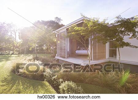 Sunny yard and modern house View Large Photo Image Stock Photograph - Sunny yard and modern house. Fotosearch
