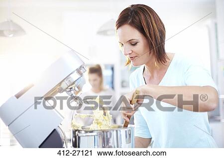 Woman baking with stand mixer in kitchen View Large Photo Image Stock Image - Woman baking with stand mixer in kitchen. Fotosearch