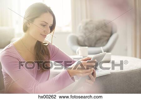 Woman using digital tablet View Large Photo Image Stock Image - Woman using digital tablet. Fotosearch