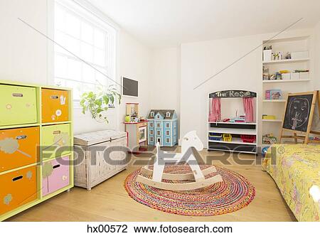 Wooden rocking horse in child’s bedroom View Large Photo Image Stock Image - Wooden rocking horse in child’s bedroom. Fotosearch