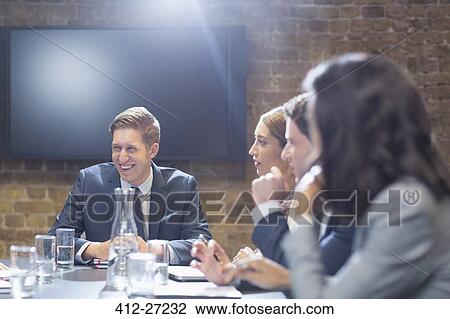 Stock Image - Business people in conference room meeting. Fotosearch