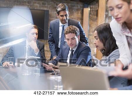 Stock Photo - Business people in conference room meeting. Fotosearch