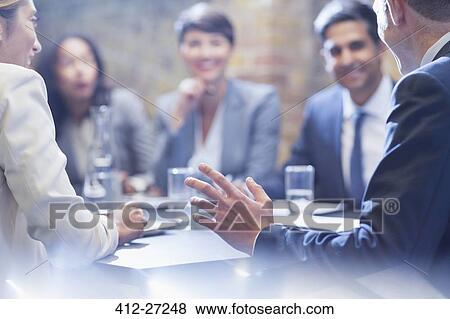 Business people talking in conference room View Large Photo Image Stock Photo - Business people talking in conference room. Fotosearch