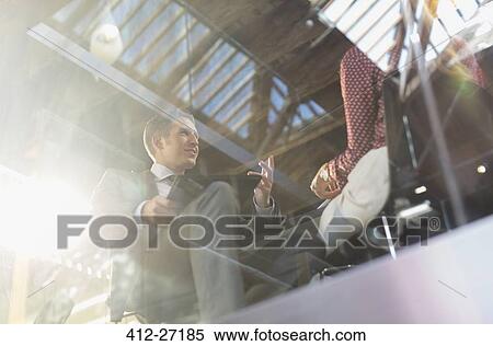 Business people talking in office meeting View Large Photo Image Stock Photography - Business people talking in office meeting. Fotosearch