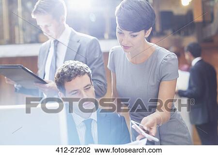 Business people working in office View Large Photo Image Stock Image - Business people working in office. Fotosearch