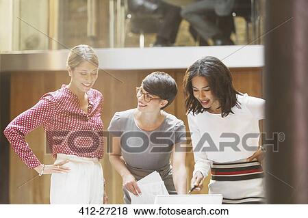 Stock Photo - Businesswomen working in office. Fotosearch