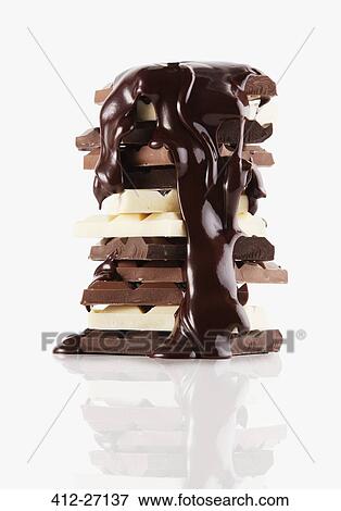 Chocolate syrup melting over chocolate bars View Large Photo Image Stock Photo - Chocolate syrup melting over chocolate bars. Fotosearch